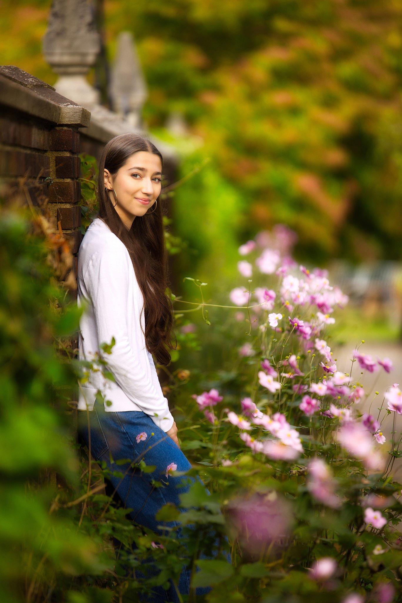 Senior portrait — Pittsburgh garden wall with pink flowers